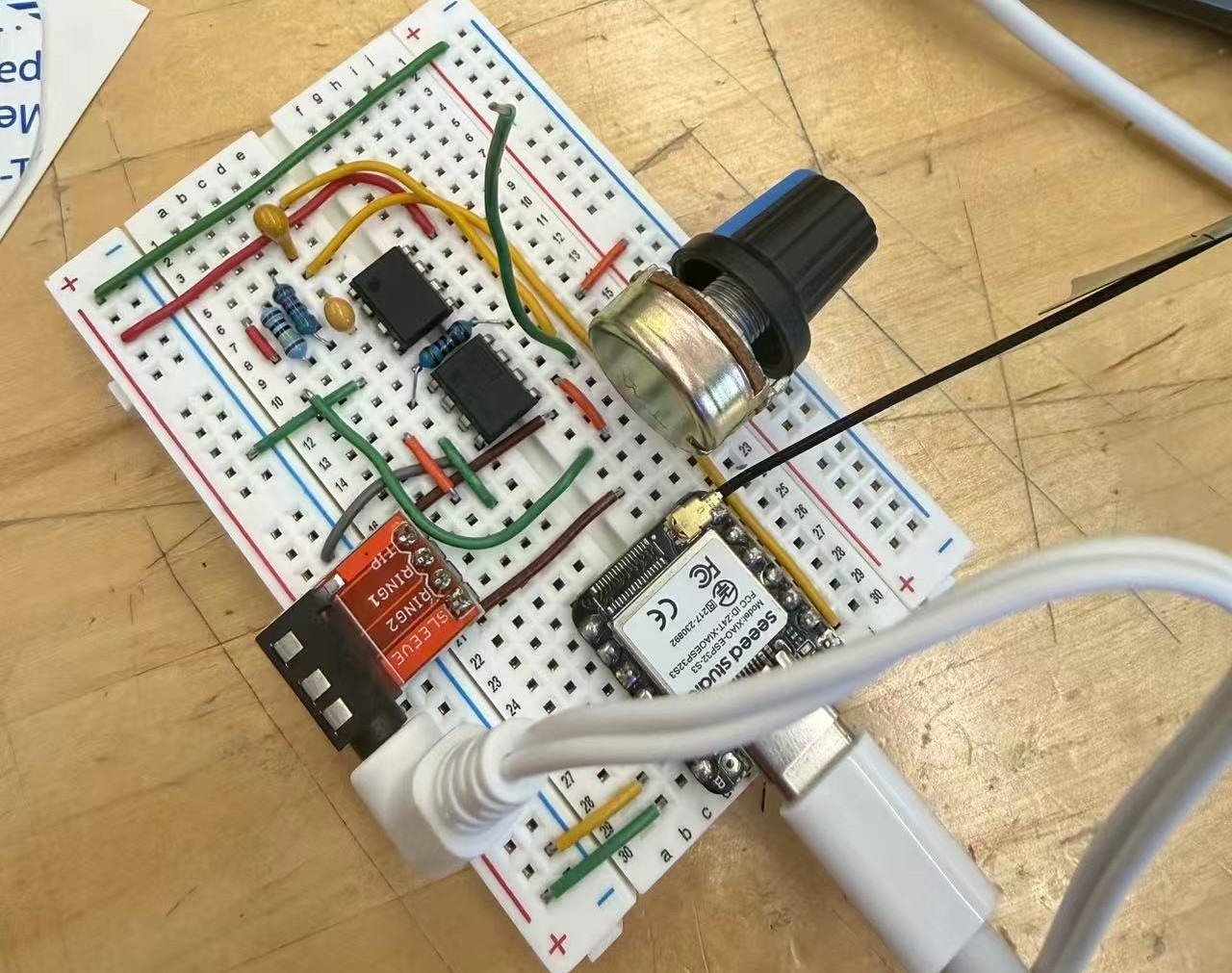 Breadboard prototype of the ECG device connected to a Seeed Studio microcontroller